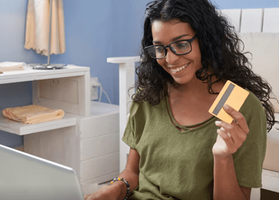 Woman shopping online with credit card